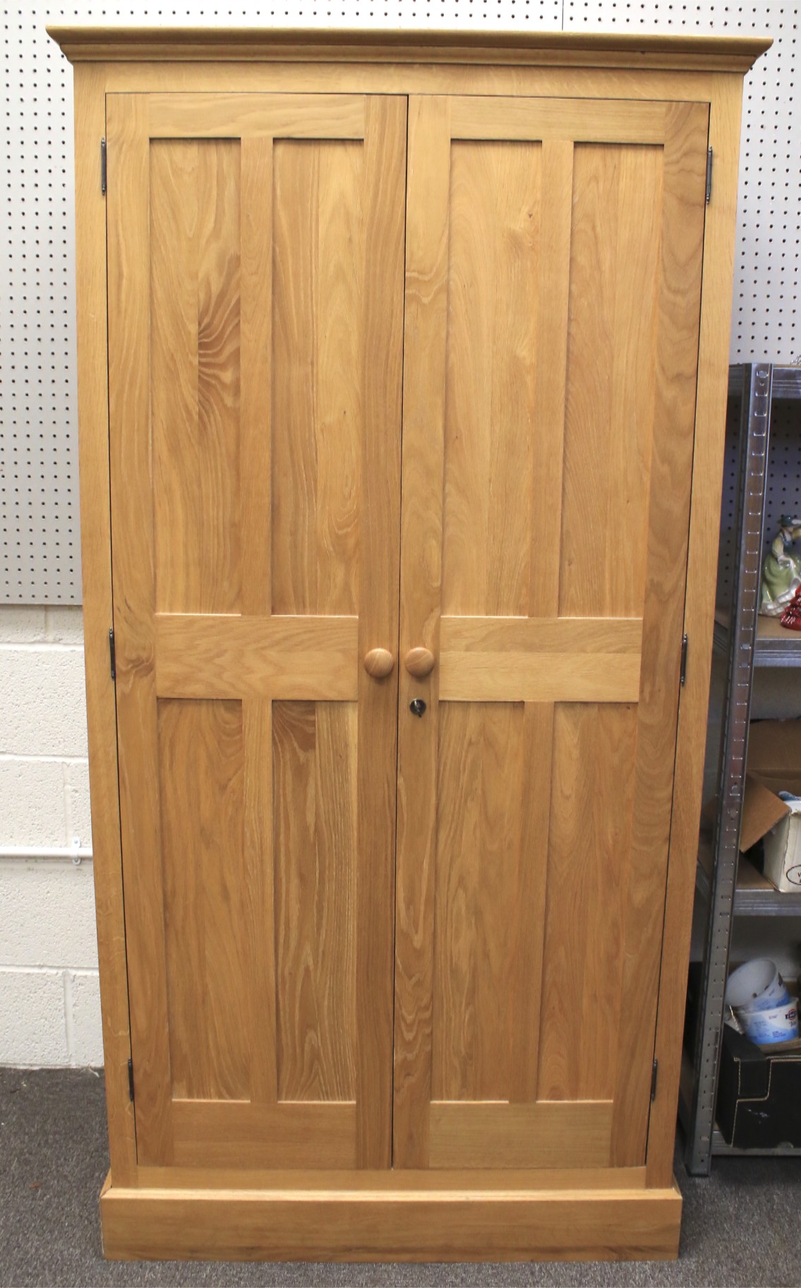 A contemporary light oak wardrobe.