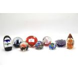 Eight assorted glass paperweights. Various sizes and designs, including Caithness and Wedgwood.