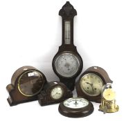 Five 20th century clocks and a barometer.