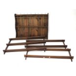 Four wooden reproduction plate racks.