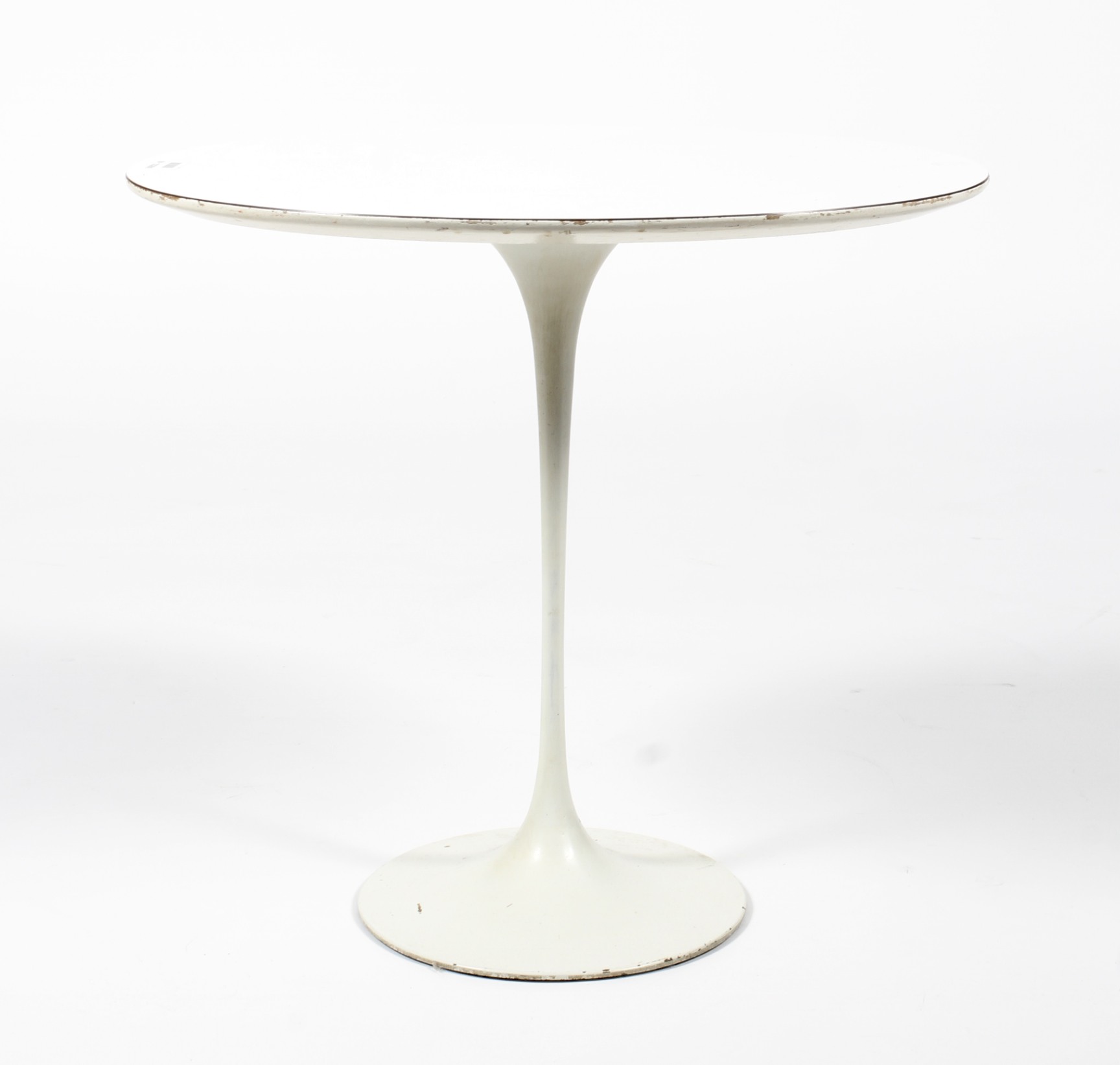 A retro tulip-shaped white painted occasional table.
