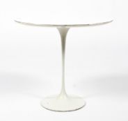 A retro tulip-shaped white painted occasional table.