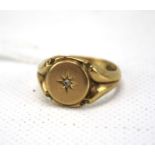 A gentleman's 9ct gold ring signet ring. With a single small gypsy set diamond to centre. Weight 5.