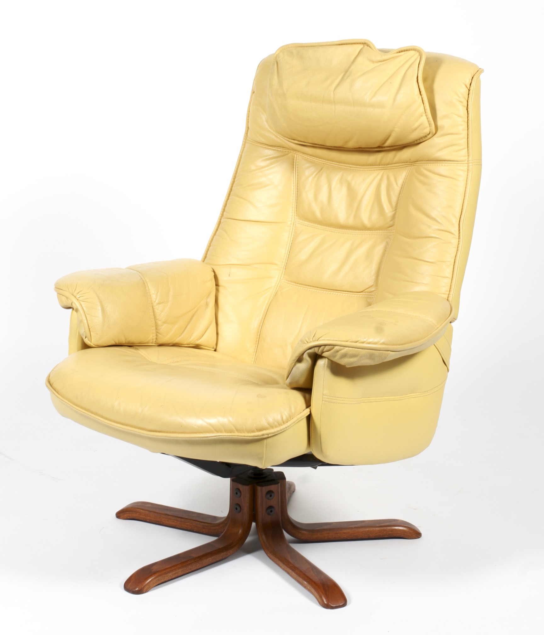 A retro pale yellow leather upholstered swivel armchair.