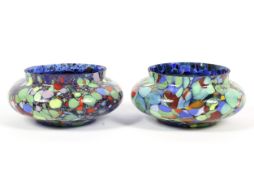 A pair of splatter glass bowls.