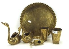 Assorted brassware, including a Middle Eastern embossed tray and two similar beakers, etc.