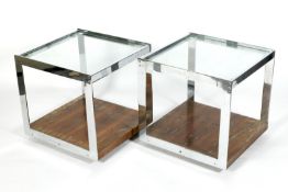 A pair of circa 1970s Merrow Associates glass topped, rosewood and chrome side tables.