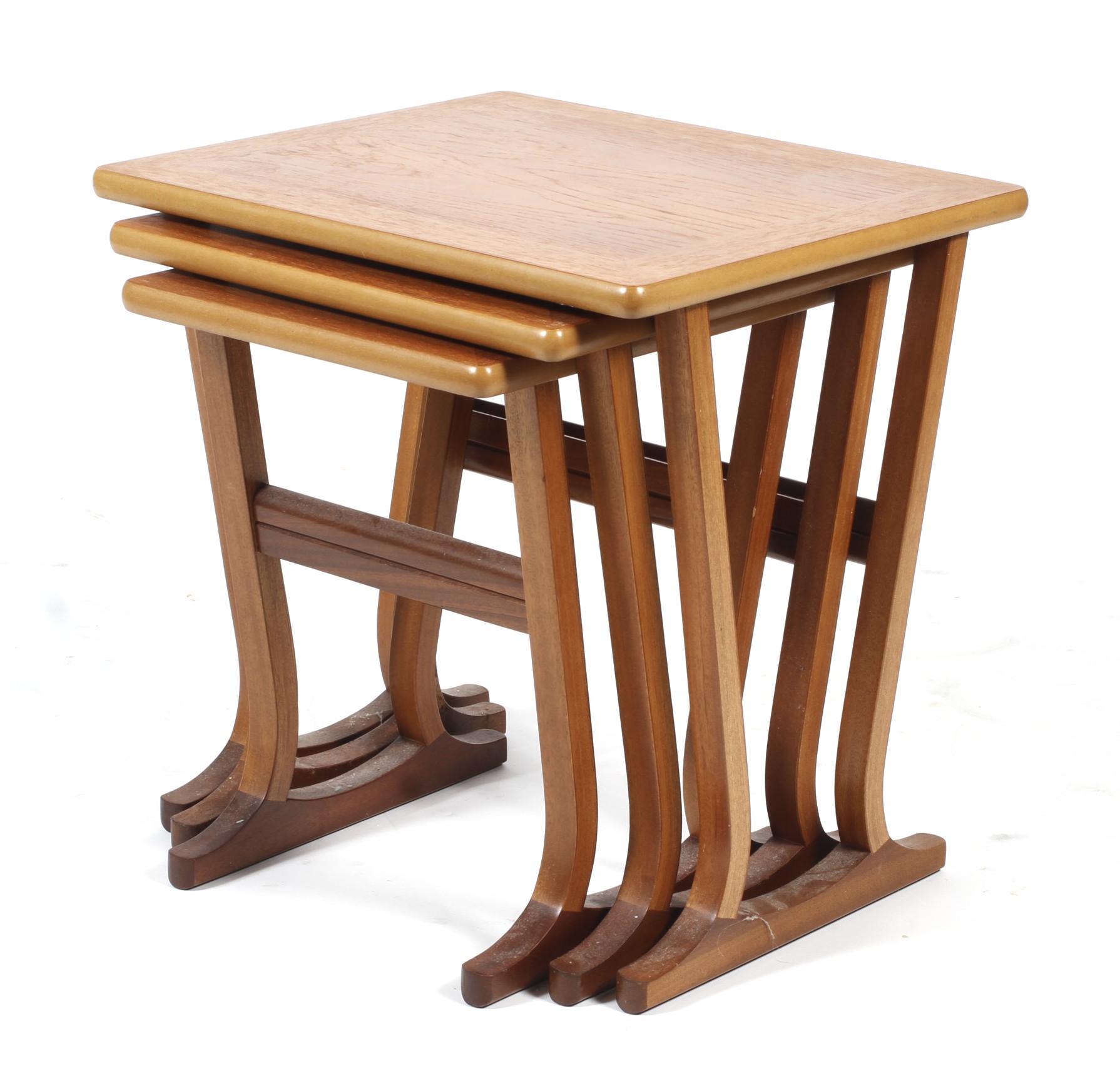 A mid-century nest of three Nathan teak occasional tables.