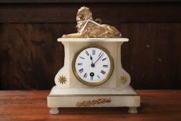 A Victorian alabaster mantel clock.