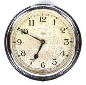 A mid-century Bakelite cased Smith's eight-day wall clock.