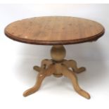 A pine tilt-top table.