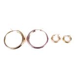 Two pairs of modern Italian gold hollow-hoop earrings.