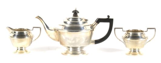 A mid century three piece silver tea set.