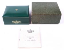 A vintage green Rolex box, circa 1960s, with original cardboard outer box.