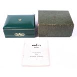 A vintage green Rolex box, circa 1960s, with original cardboard outer box.