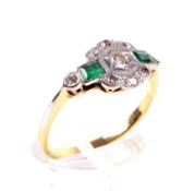 An Art Deco period emerald and diamond cluster ring.