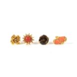 Four gold dress rings: two set coral, one with smoky quartz hardstone, 32.