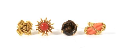 Four gold dress rings: two set coral, one with smoky quartz hardstone, 32.