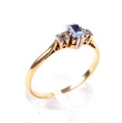 A mid-20th century gold, sapphire and diamond three stone ring.