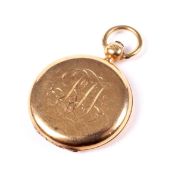 An Edwardian 18ct gold round locket.