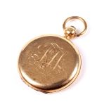 An Edwardian 18ct gold round locket.