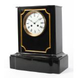 A late Victorian slate striking mantel clock.