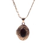 A 9ct gold small oval locket and chain.