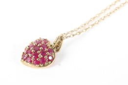 A 9ct gold and ruby encrusted heart-shaped pendant necklace and a pair of earrings.