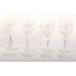 Eight Waterford cut wine glasses. With panel cut bowls, on faceted stems, 18.