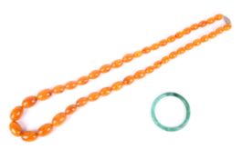 An imitation-amber graduated oval bead necklace.