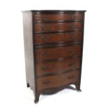 A Georgian style mahogany serpentine chest of drawers.