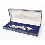 A cultured pearl single row necklace. The uniform beads approx. 4.8-5.
