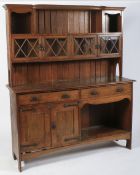 An Arts and Crafts Liberty style oak dresser, circa 1900.