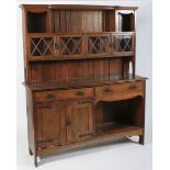 An Arts and Crafts Liberty style oak dresser, circa 1900.