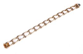 A Continental yellow metal angular-faceted-curb link bracelet on a push-snap. Stamped '750', 39.