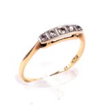 An Art Deco gold and diamond five stone ring.