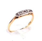 An Art Deco gold and diamond five stone ring.