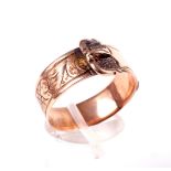 A late Victorian 9ct rose gold 'buckle' ring.