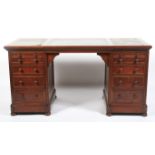 A large mahogany twin pedestal desk.