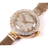 A ladies 18ct gold cased cocktail watch with diamond set bezel.