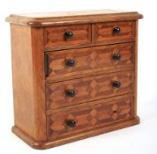 A late 19th/early 20th century oak and parquetry inlaid apprentice chest.