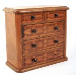 A late 19th/early 20th century oak and parquetry inlaid apprentice chest.