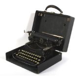 An early 20th century LC Smith & Corona portable typewriter.