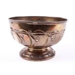 An embossed silver footed bowl.