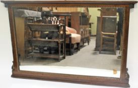 A Georgian style parcel gilt carved wood overmantel mirror, early 20th century.