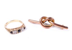 A 9ct gold, tiny sapphire and diamond five stone ring and a gold lovers knot brooch.