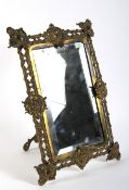 A Victorian brass mirror frame.