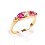 An early 20th century gold, pink sapphire and diamond five stone panel ring and a box.