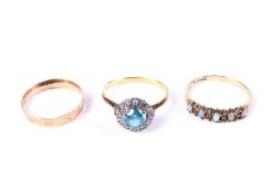 Three gold and gem set rings.