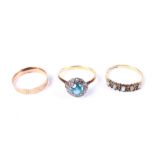 Three gold and gem set rings.